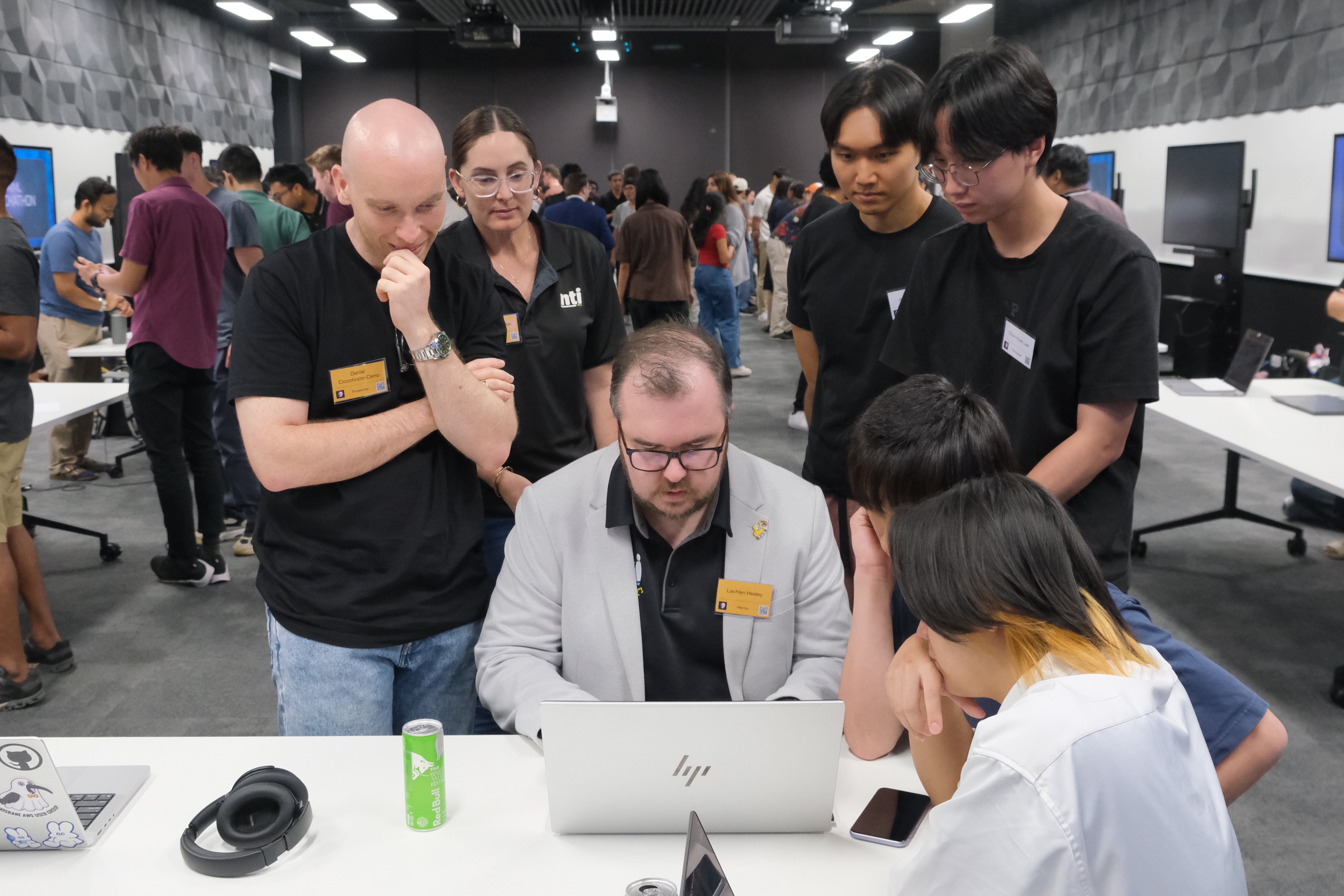 Mentors reviewing an AIML Hackathon team project