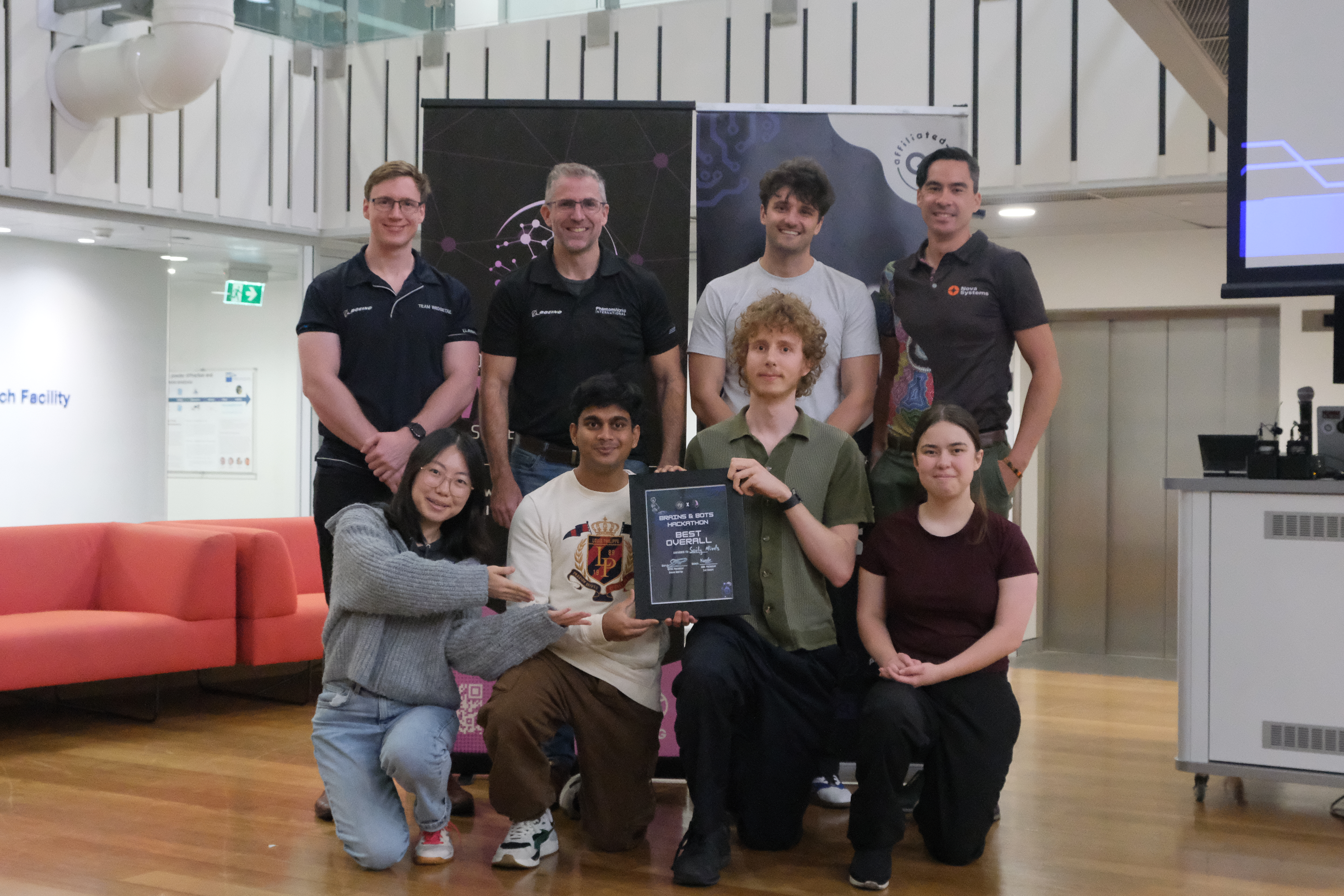 Brains and Bots Hackathon Best Overall Award recipients with organisers